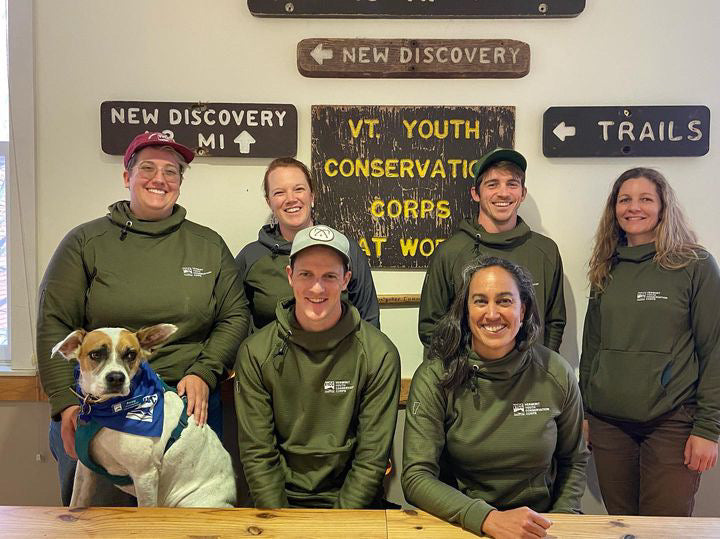 A group of Thuja Green custom embroidered Burrow fleece hoodies worn by Vermont Conservation Corps (VYCC) staff members.